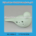 Elegant ceramic bird figurine with hollow-out design